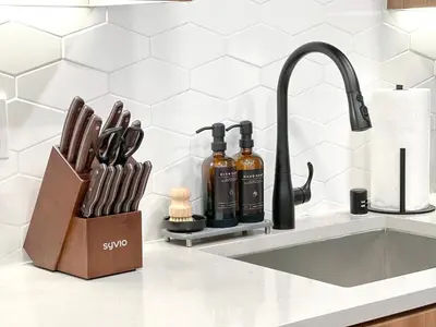 a kitchen counter with a knife block and a sink at Modern Cosmopolitan APT Mid Hollywood with Free Parking 10mins to Universal Studios in Los Angeles
