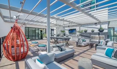 a living room with white furniture and a glass ceiling at Modern Cosmopolitan APT Mid Hollywood with Free Parking 10mins to Universal Studios in Los Angeles