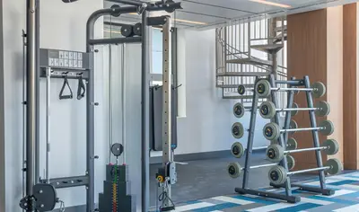 a room with a gym with tread machines at Modern Cosmopolitan APT Mid Hollywood with Free Parking 10mins to Universal Studios in Los Angeles