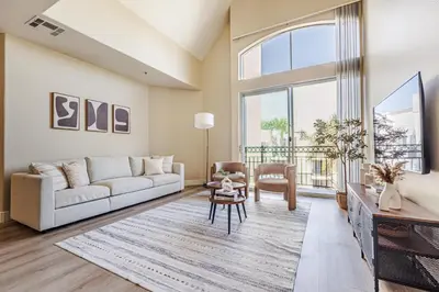 a living room with a couch and a table at 2BD Marina Condo Near Venice Beach, Pool & Free Parking in Los Angeles