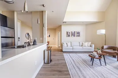 a kitchen and living room with a couch at 2BD Marina Condo Near Venice Beach, Pool & Free Parking in Los Angeles