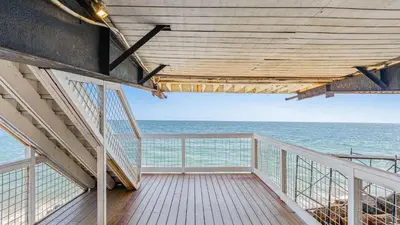 a balcony with a view of the ocean at Beach Retreat with Oceanfront Balconies Direct Beach Access Pacific Coast Outlook by AvantStay in Malibu Beach