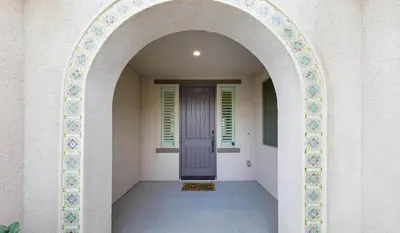 an archway leading to a door in a building at Modern 3BR Home Gated Community in Bakersfield