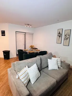 a living room with a couch and a table at The Hollywood loft FREE Parking in Los Angeles