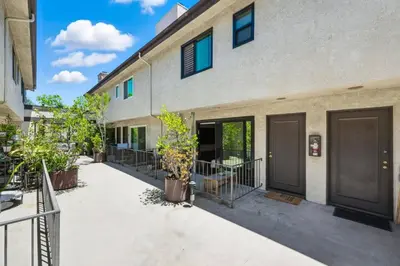 an exterior view of a building with doors and plants at Burbank Bliss Retreat in Los Angeles