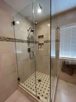a shower with a glass door in a bathroom at Beautiful and cozy! in Palmdale
