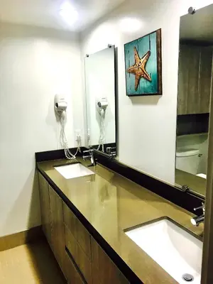 a bathroom with two sinks and a starfish on the wall at Western Sierra Vista in Los Angeles