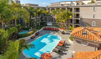 an overhead view of a pool at a resort with palm trees at Marina Del Rey 2-Bedroom and 1-Bedroom - Close To Beach in Los Angeles