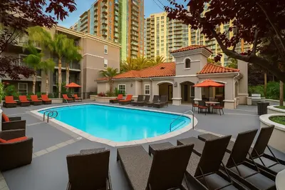 a swimming pool with chairs and tables and buildings at Marina Del Rey 2-Bedroom and 1-Bedroom - Close To Beach in Los Angeles