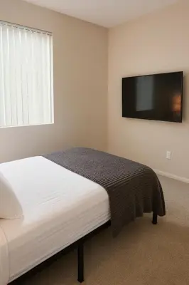 a bedroom with a bed and a flat screen tv at Marina Del Rey 2-Bedroom and 1-Bedroom - Close To Beach in Los Angeles