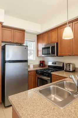 a kitchen with a stainless steel refrigerator and a sink at Marina Del Rey 2-Bedroom and 1-Bedroom - Close To Beach in Los Angeles
