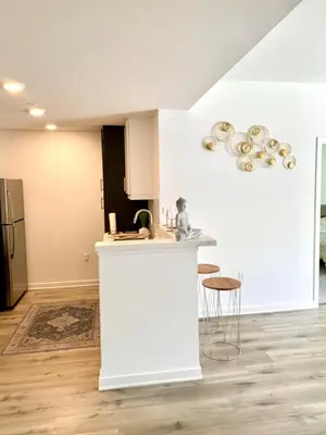a kitchen with a white island in a room at Luxury Hollywood Stay Beautiful 2Beds2Baths in Los Angeles