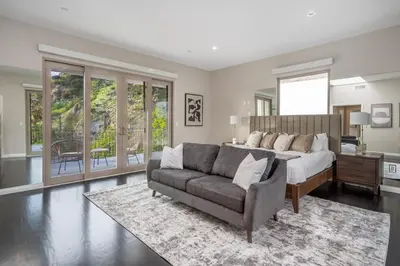 a large bedroom with a bed and a couch at Spacious Hollywood Private Villa with 7 Bedrooms and Pool in Los Angeles