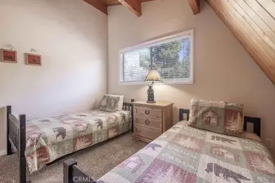 a bedroom with two beds and a window at Navigate Stays Best Location Pet Friendly Games in Big Bear City