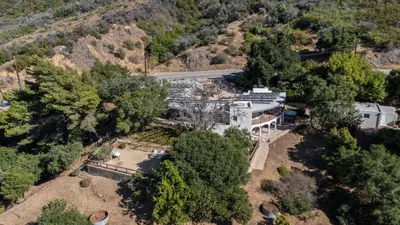 an aerial view of a building in the middle of trees at Malibu Hills Studio w Mountain Views Near beaches Cielo Nook by AvantStay in Malibu Beach