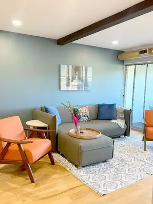 a living room with a couch and a table at Echo Lake view condo - newly renovated - centrally located in Los Angeles