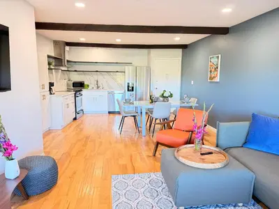 a living room with a couch and a table at Echo Lake view condo - newly renovated - centrally located in Los Angeles