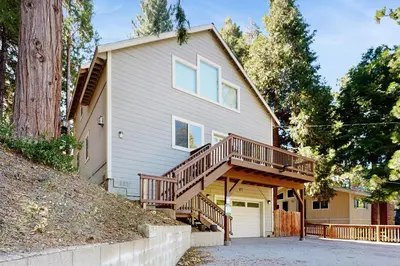 a house with a porch and a deck at 7 Mi to Snow Valley Mountain Resort Quiet Cabin in Running Springs