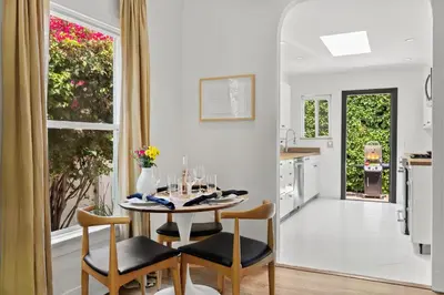 a kitchen and dining room with a table and chairs at New Listing Midcity West Villa by Colby & Conrad in Los Angeles