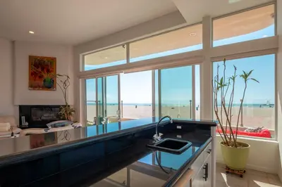 a kitchen with a view of the beach at Time2Relax in Oxnard