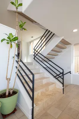 a staircase in a house with a plant at Time2Relax in Oxnard