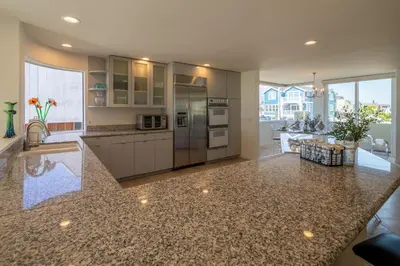 a kitchen with stainless steel appliances and a counter top at Time2Relax in Oxnard