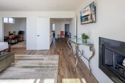 a living room with a fireplace and a couch at Time2Relax in Oxnard