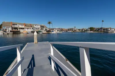 a boat is docked in a body of water at Harbor View in Oxnard