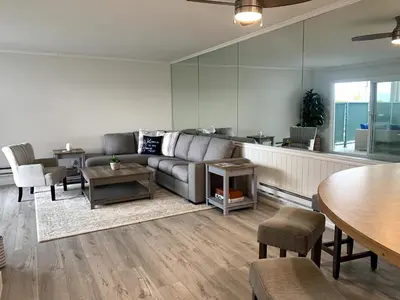 a living room with a couch and a table at Waterfront 104 in Oxnard