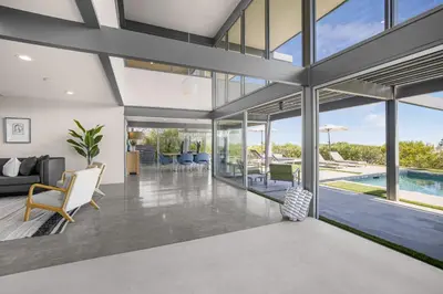 an open living room with sliding glass doors at Solara Point in Los Angeles