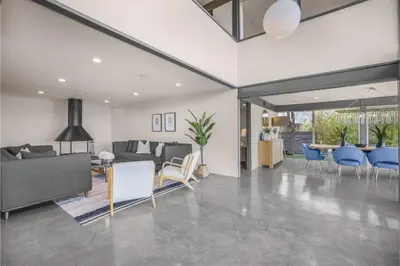 a living room with a couch and chairs and a table at Solara Point in Los Angeles