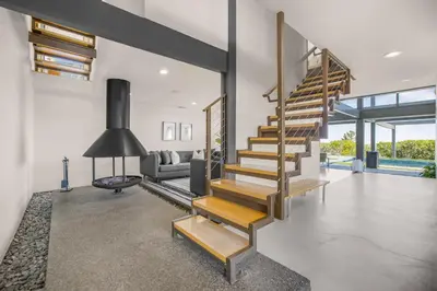 a staircase in a house with a living room at Solara Point in Los Angeles