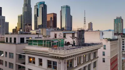 a view of a city skyline with tall buildings at Skyline Lofts by AvantStay: a multi-level industrial-chic retreat in DTLA with rooftop views soaring ceilings steps to dining music culture in Los Angeles
