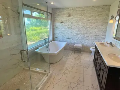 a bathroom with a tub and a shower and a sink at Spectacular City Mountain Views Remodeled Open Plan 3 bdr Home Pool Jacuzzi Oasis in Engine Company Number 109 Heliport