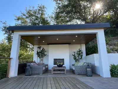 a covered patio with couches and a fireplace at Spectacular City Mountain Views Remodeled Open Plan 3 bdr Home Pool Jacuzzi Oasis in Engine Company Number 109 Heliport