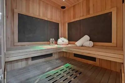 a sauna with wooden walls and a wooden floor at Playa Del Sol by Stay Awhile Villas in Malibu Beach