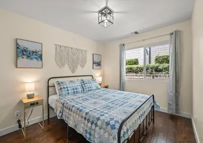 a bedroom with a bed and a window at Cozy&Stylish DT Alhambra Living walk to Starbucks in Alhambra