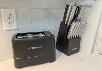 a black toaster next to a box of knives at Cozy&Stylish DT Alhambra Living walk to Starbucks in Alhambra