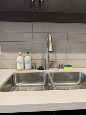 a kitchen sink with two bottles of dishes on it at The Hollywood Blvd Loft FREE AND DESIGNATED PARKING in Los Angeles