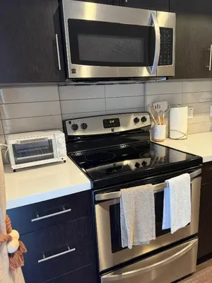a kitchen with a stove and a microwave at The Hollywood Blvd Loft FREE AND DESIGNATED PARKING in Los Angeles