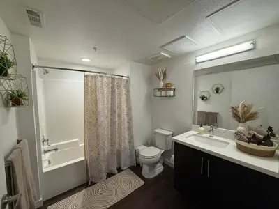 a bathroom with a toilet and a sink and a shower at The Hollywood Blvd Loft FREE AND DESIGNATED PARKING in Los Angeles
