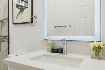a bathroom sink with a bottle of soap on it at #Marbella Lane - Cityside Haven with Touch of Charm in Compton