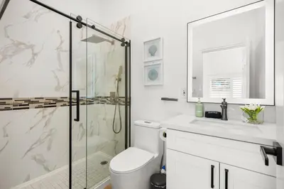 a bathroom with a shower and a toilet and a sink at #Marbella Lane - Cityside Haven with Touch of Charm in Compton