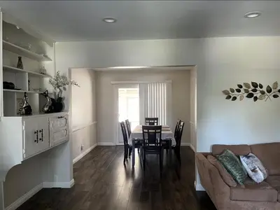 a living room with a table and a couch at Northridge 3BR 2BA Home with Pool on a Tree-Lined street, Close to CSUN in Northridge