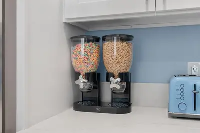two glass vases filled with food in a kitchen at Enchanted Dreams by OC Adventure Homes in Garden Grove