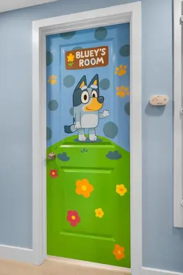 a cartoon simpsons door sticker in a room at Enchanted Dreams by OC Adventure Homes in Garden Grove