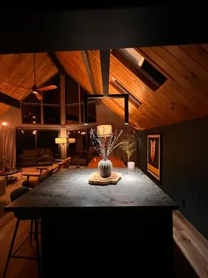 a room with a table with a vase on it at BlackOak Hideaway in Lake Arrowhead