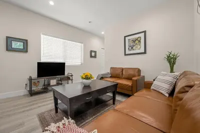 a living room with a couch and a table at Stay on Hart in Los Angeles