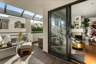 a living room with a couch and a fireplace at Oceanfront Artists Retreat Santa Monica Luxury in Los Angeles