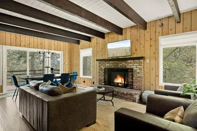 a living room with a couch and a fireplace at The Mountain Sanctuary in Lake Arrowhead